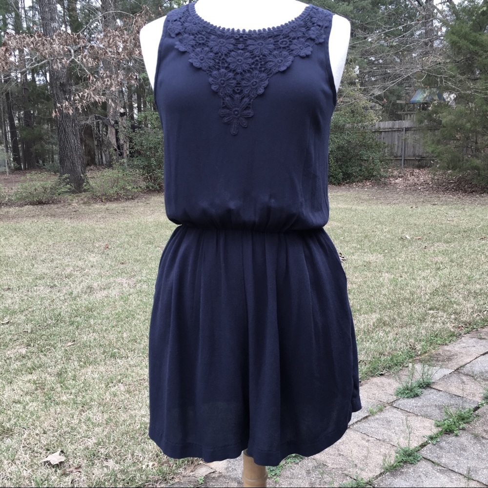 Adorable navy romper with pockets